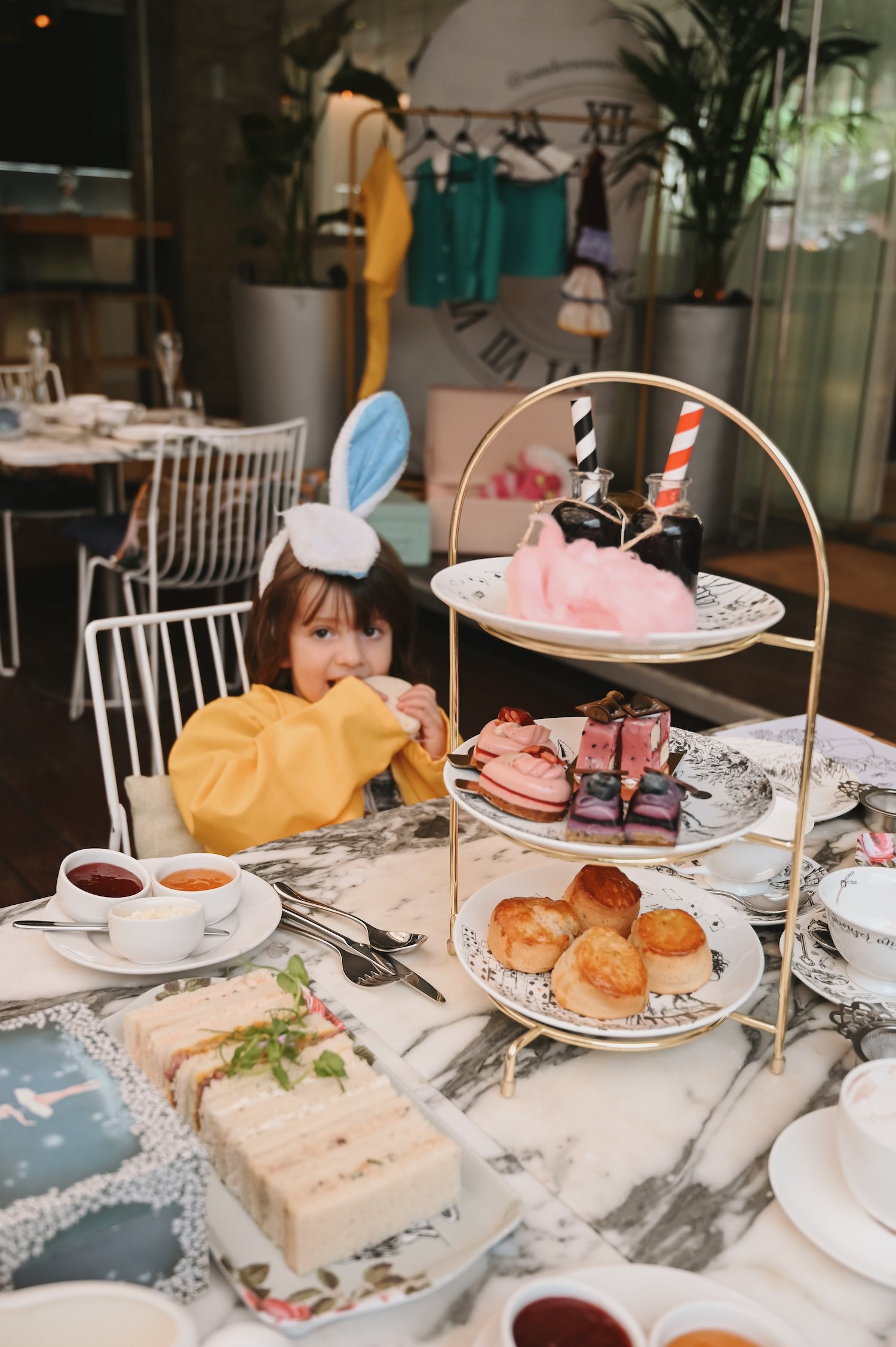 Child enjoying the Mad Hatter's Alice in Wonderland Afternoon Tea at The Sanderson London