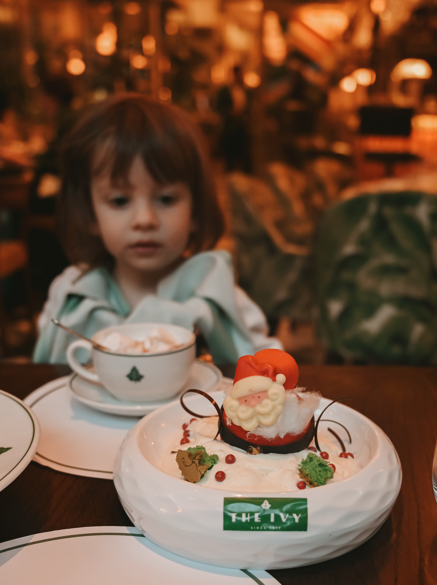 Small Child having lunch at the Ivy at Christmas