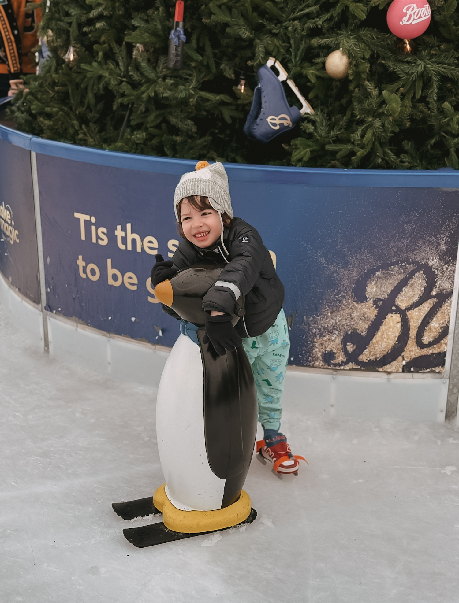 Small boy at Glide ice rink at Battersea Power Station